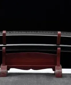 A large Odachi Katana greatsword and its scabbard displayed on a wooden stand.