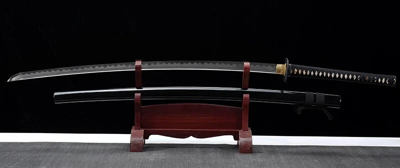 Odachi Katana A large Odachi Katana greatsword and its scabbard displayed on a wooden stand.