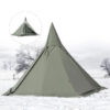 A green colored teepee tent erected on winter snow ground.