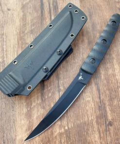 A small tactical knife displayed next to its sheather, lying on a wooden door.