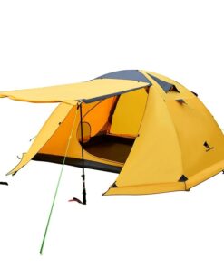 A yellow colored 4 person dome tent, with its front awning erected with guy-ropes and trekking poles.