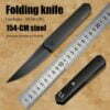 A defensive folding dagger shown in both opened blade and closed positions next to a measurement ruler.