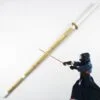 A bamboo Shinai sword with a Kendo martial artist demonstating sword use.