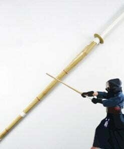 A bamboo Shinai sword with kendo martial artist demonstating sword use.
