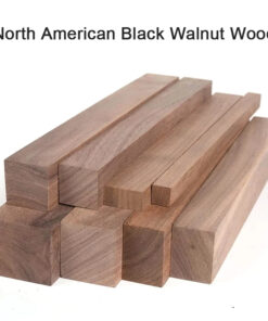 Multiple blocks of North American black Walnut wood stacked.