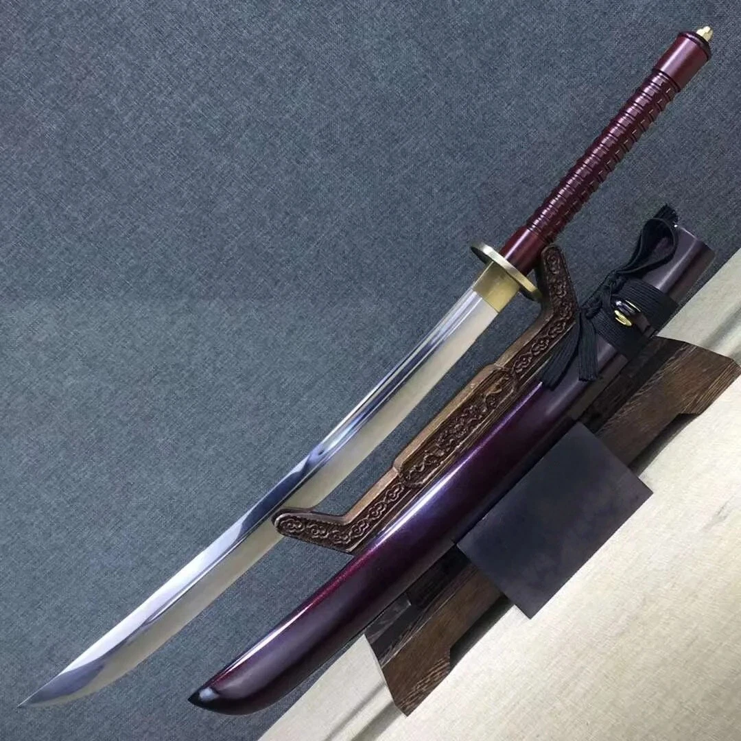 Chinese Broadsword For Sale A two handed Chinese broadsword for sale, displayed next to its scabbard, on a small wooden stand.