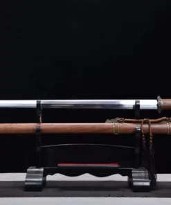 A Chinese Jian sword, with a straight, double edged blade, displayed next to its wooden scabbard, on a small sword stand.