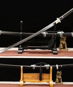 A Chinese curved blade sword displayed leaning against its decorative scabbard, situated on a small wooden stand.