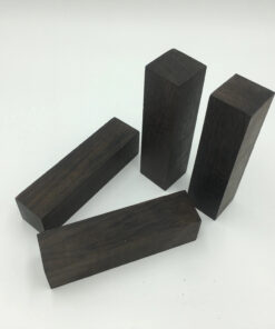 Four dark Ebony wood blocks.