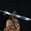 A Falchion sword balanced on a wood log.