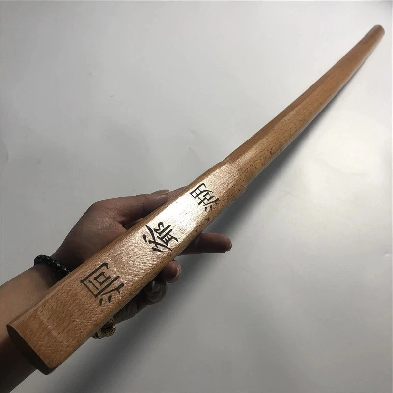 Japanese Bokken A man's hand holding a wooden Japanese bokken sword.
