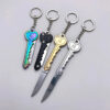 A key knife set of four, with two key knives displayed closed and the other two shown with knife blades opened.