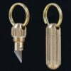 A small pendant knife shown both with the blade exposed and closed within its canister.