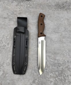 A large field knife with brown handle and silver blade next to its black sheath, lying on a grey concrete floor.