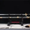 A Longquan sword Jian with scabbard on display-stand.
