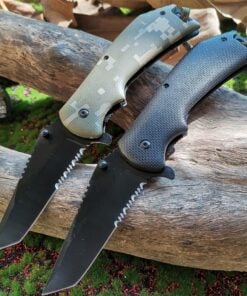Two folding military pocket knives with blades extended, lying against a log.