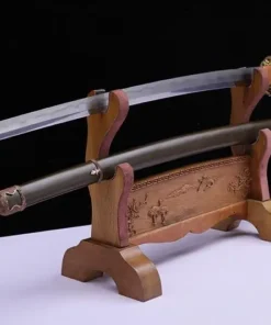 A WW2 military sword Katana displayed on a small wooden stand, next to its army green scabbard.