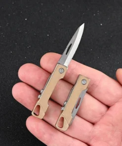 A man's hand holding a mini edc knife.