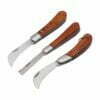 Three folding mushroom knives of different design, with blades opened.
