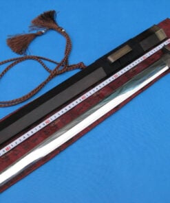 A one handed sword Jian, displayed next to its scabbard on a red colored sword-bag.