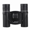 Black colored, compact pocket binoculars.