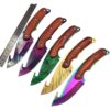 Five different color skinning knives next to a steel ruler.