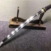 A Wakizashi small sword, displayed leaning against a small, wooden sword-stand.