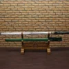 A green colored straight Katana sword and its green scabbard, displayed on a wooden stand.