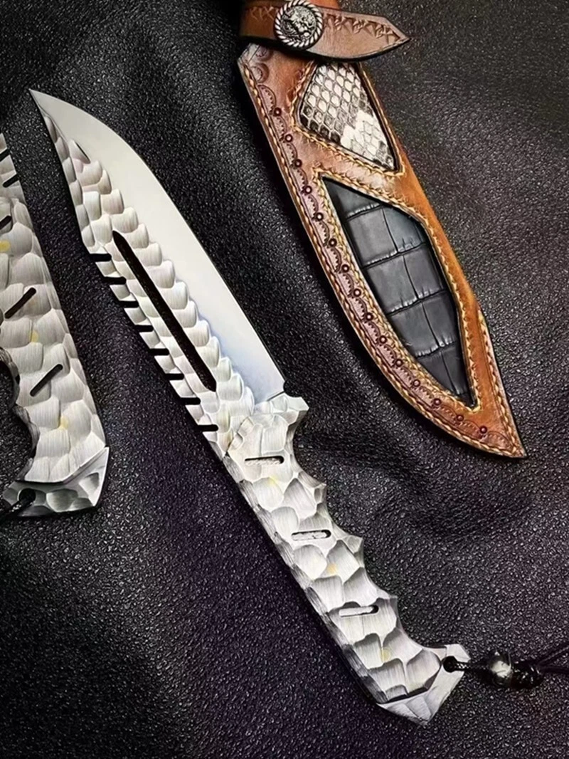 Tactical Bowie Knife A fixed blade tactical bowie knife, displayed next to its leather sheath.