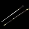 A walking stick sword displayed next to its scabbard.