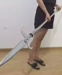 A man holding a hooked warrior spear weapon.