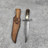 A Damascus bowie knife with sheath.