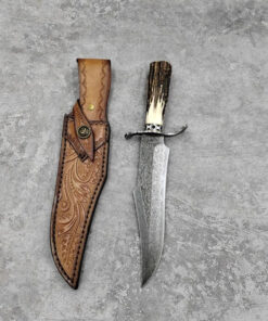 A Damascus bowie knife with sheath.