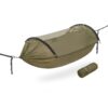 An erected jungle hammock, with storage bag size example below the hammock.