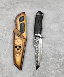 A skeleton themed stabbing knife with knife sheath.