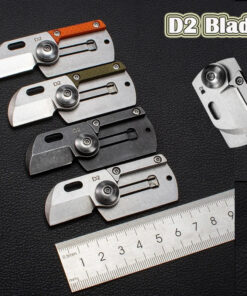 Four dog tag knife models displayed next to a steel ruler.
