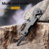 A multitool hiking knife displayed agaist rock.