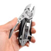 A hand holding a wrench multi tool with pocket clip.