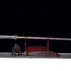 A short spear sword lying level on a wooden stand.
