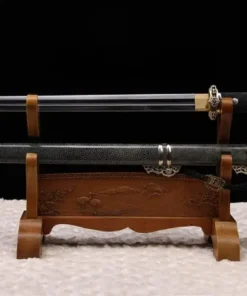 A Chinese straight sword Jian, displayed next to its decorative scabbard, on a small wooden stand.