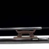 A demon slayer sword real Jian weapon displayed on a wooden sword-stand, with its decorative scabbard below on the floor.