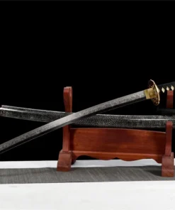 A gold dragon sword Katana displayed next to its scabbard, on a small wooden sword-stand.