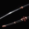 A Chinese Miao Dao sword displayed next to its decorative scabbard.