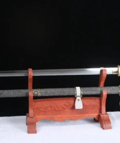A single edged sword and its scabbard displayed on a wooden stand.