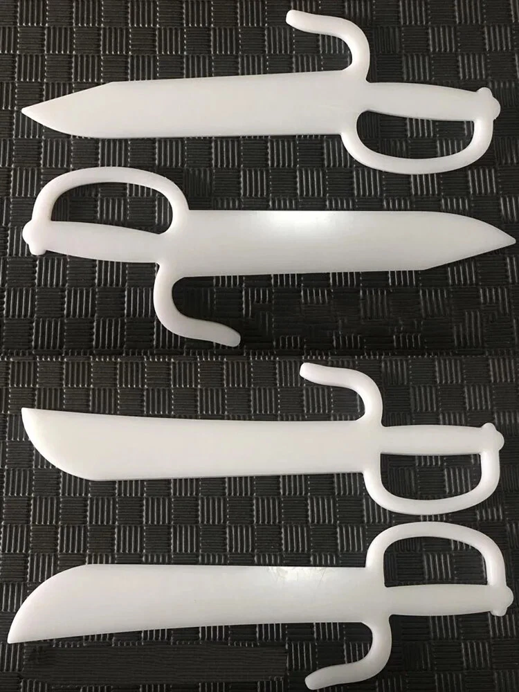 Best Practice Butterfly Knives Two sets of practice butterfly knives, displayed side-by-side