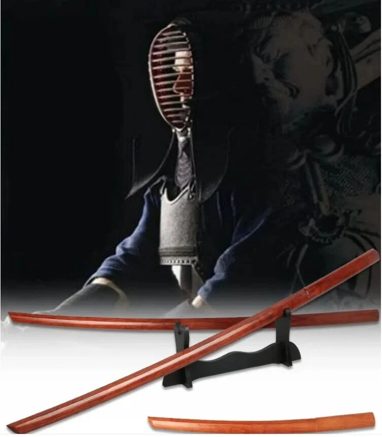 Bokken Two hardwood bokken swords displayed on a small stand, with a small Wakizashi bokken below and a man wearing Kendo armor above.