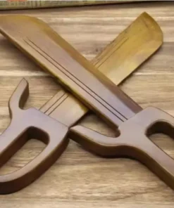 Two wooden butterfly swords displayed with blades crossed, on a wood bench surface.
