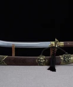 A curved short sword displayed on a small wooden-stand, with its decorative scabbard below on the floor.