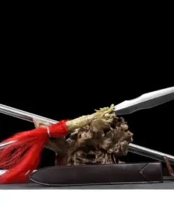 A dragon spear weapon displayed leaning on a wood log, with its pole handle extension.