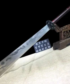 A Chinese broad sword leaning against a wooden stand.